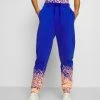 Brandneu 👏 Karl Kani SIGNATURE PAINT SPLATTER - Jogginghose - Blue, Damen 🛒