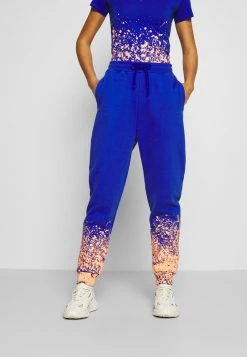 Brandneu 👏 Karl Kani SIGNATURE PAINT SPLATTER - Jogginghose - Blue, Damen 🛒