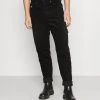 Budget ❤️ Karl Kani UNISEX RETRO PANTS - Stoffhose - Black ⌛ 13 Budget ❤️ Karl Kani UNISEX RETRO PANTS - Stoffhose - Black ⌛ -Karl Kani Verkäufe 24952fceb8104fc998afffec6652072e