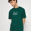 Brandneu ❤️ Karl Kani UNISEX SIGNATURE TEE - T-Shirt Print - Green ❤️