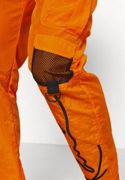 Besorgen 🔔 Karl Kani SIGNATURE CRINCLE PANTS UNISEX - Cargohose - Orange 😀 -Karl Kani Verkäufe 7a99ca0439184026a0d949411495245c