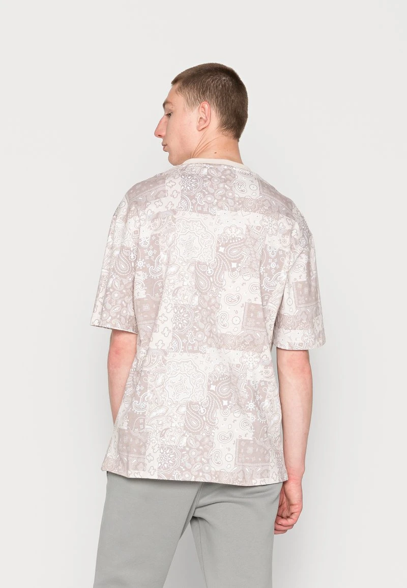 Brandneu 🎁 Karl Kani SMALL SIGNATURE TEE LIGHT UNISEX - T-Shirt Print - Sand 😉 3 Brandneu 🎁 Karl Kani SMALL SIGNATURE TEE LIGHT UNISEX - T-Shirt Print - Sand 😉 – Bild 3