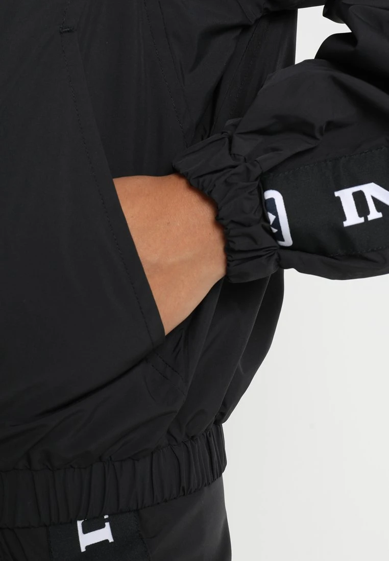 Großhandel 🎁 Karl Kani TAPE - Leichte Jacke - Black/white, Damen ✨ 5 Großhandel 🎁 Karl Kani TAPE - Leichte Jacke - Black/white, Damen ✨ – Bild 5